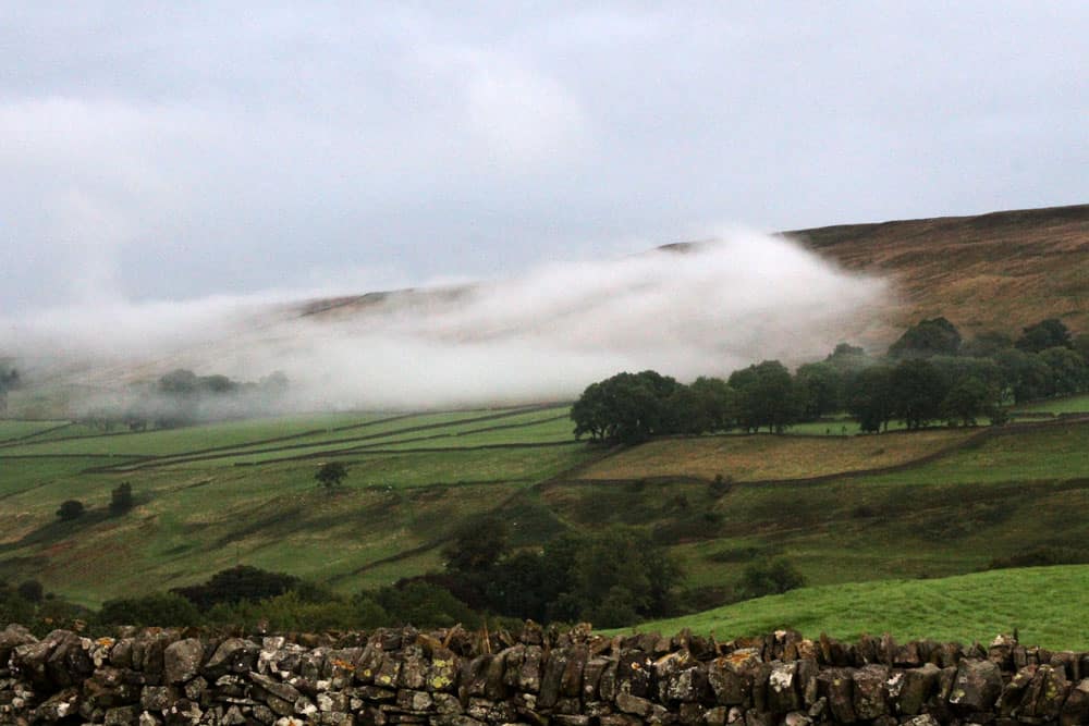The clouds frame the valley